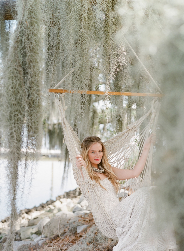 Katherine McDonald’s “Hemingway” gown from Kate McDonald Bridal and Lovely Bride. Ann Lightfoot necklace from RTW. Hammock chair from Fox Events