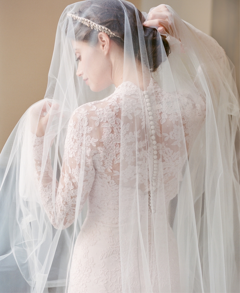Legends Romona Keveza’s L7125 rose  lace fit-to-flare gown with illusion blouse, both from Maddison Row. Photographer’s vintage crown. Untamed Petals’ “Cypress” veil from Lovely. (Photo by Corbin Gurkin)