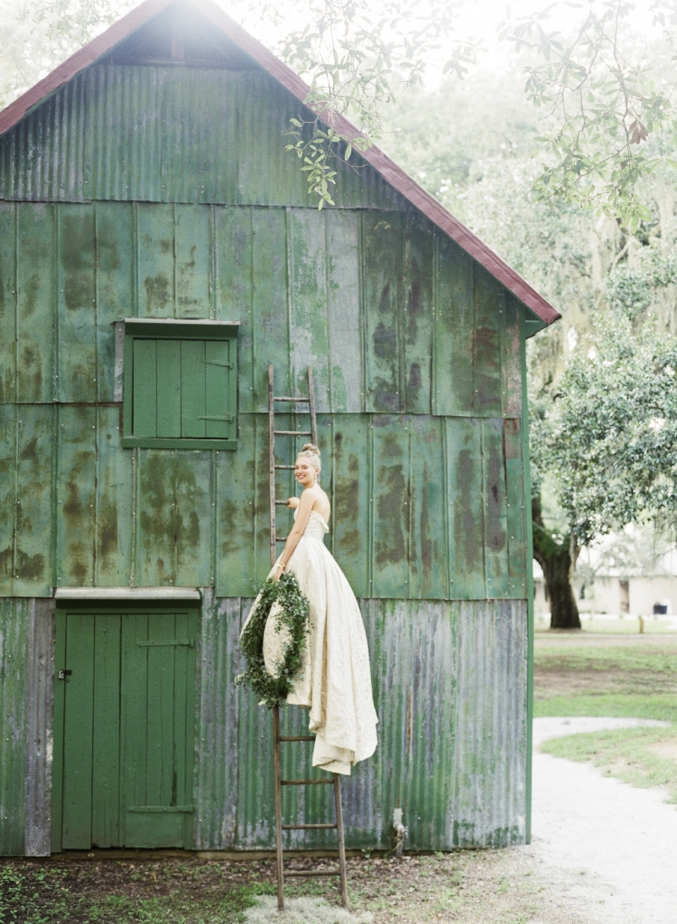 Modern Trousseau’s “Pride” gold brocade high-low gown from Modern Trousseau Charleston. Ladder from Page’s Thieves Market. Photograph by Corbin Gurkin.
