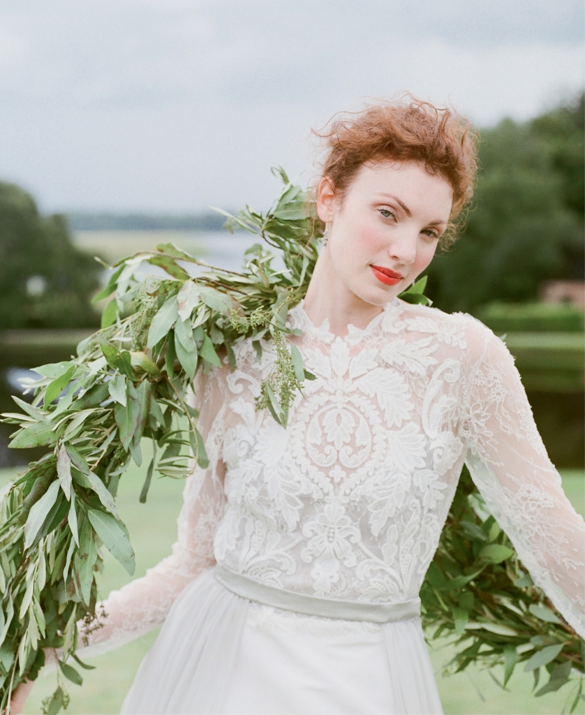 Emily Kotarski’s “Buckingham” silk gown with illusion lace top, faille skirt, and detachable chiffon train from Emily Kotarski Bridal. Sapphire and diamond earrings from Croghan’s Jewel Box. Seeded eucalyptus garland from Out of the Garden.   &lt;i&gt;Photograph by Corbin Gurkin&lt;/i&gt;