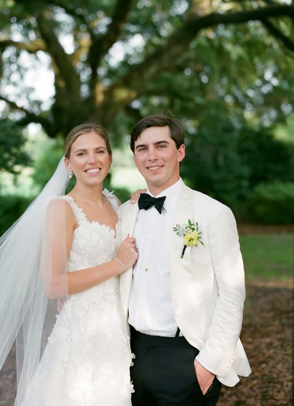 The couple wed outside at the pastoral Yeamans Hall Club.