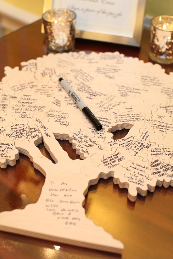PICTURE THIS: Guests wrote their well wishes and signatures on an oak tree-shaped puzzle.