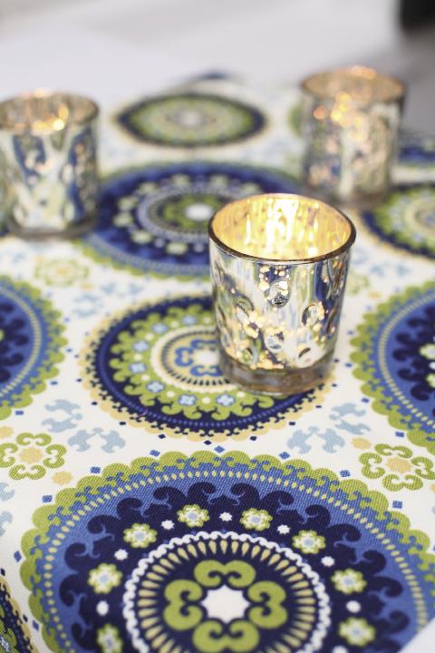 THERE&#039;S NO PLACE LIKE HOME: Fashioned into table toppers at the reception, the fabric gave a fresh, modern look to the décor, which mimicked that of the couple’s home.