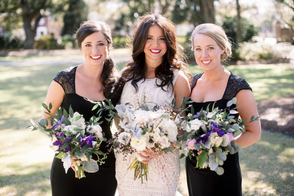 Bride&#039;s gown by Lazaro (available locally at Gown Boutique of Charleston). Bridesmaids&#039; dresses by Ralph Lauren. Florals by Stems Floral Design by Jonie Larosee. Image by Timwill Photography.