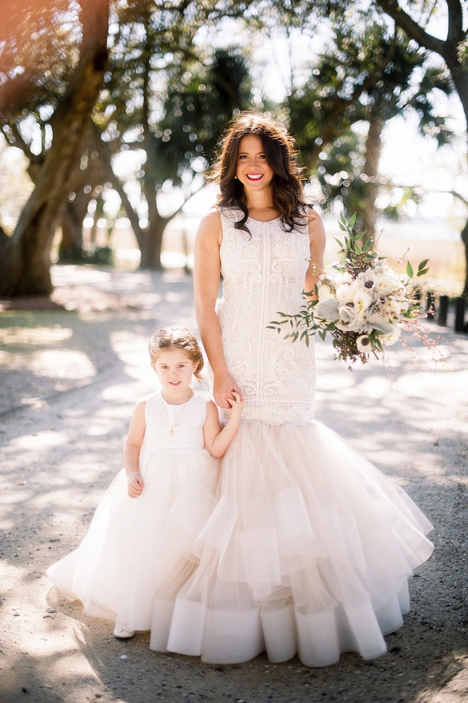 Bride&#039;s gown by Lazaro (available locally at Gown Boutique of Charleston). Florals by Stems Floral Design by Jonie Larosee. Image by Timwill Photography at Lowndes Grove Plantation.