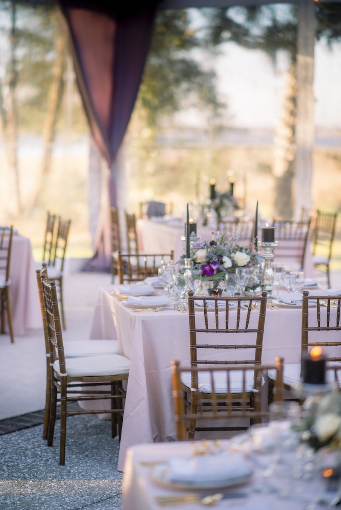 Wedding design by A Charleston Bride. Tables, chairs, china and stemware from Snyder Events. Linens from BBJ Linens. Florals by Stems Floral Design by Jonie Larosee. Image by Timwill Photography.