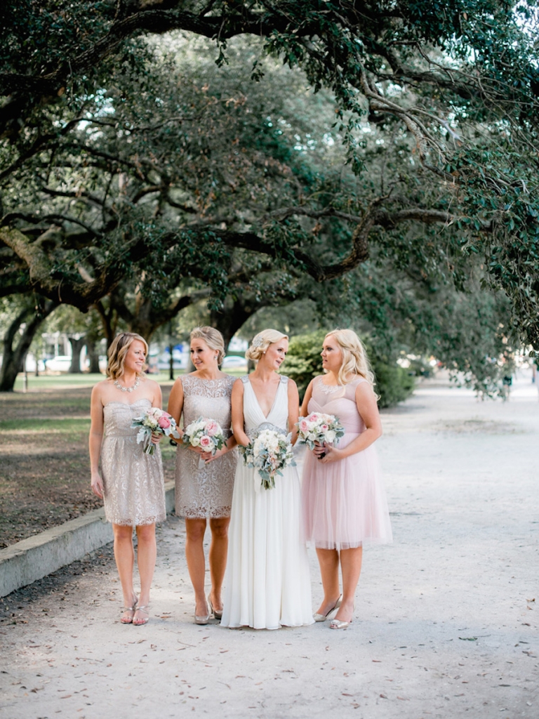 Bridesmaids’ dresses by Jenny Yoo (available locally through Bella Bridesmaids and Fabulous Frocks) and BHLDN. Bride’s gown by Jenny Packham (available locally through White on Daniel Island). Bouquets by Out of the Garden. Image by Brandon Lata Photography at Boone Hall Plantation and Cotton Dock.