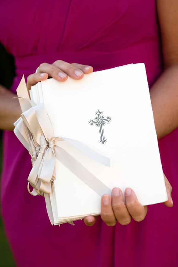 BOW-TIED: Atlanta stationer Paper Paces bound cross-adorned wedding programs with satin ties.