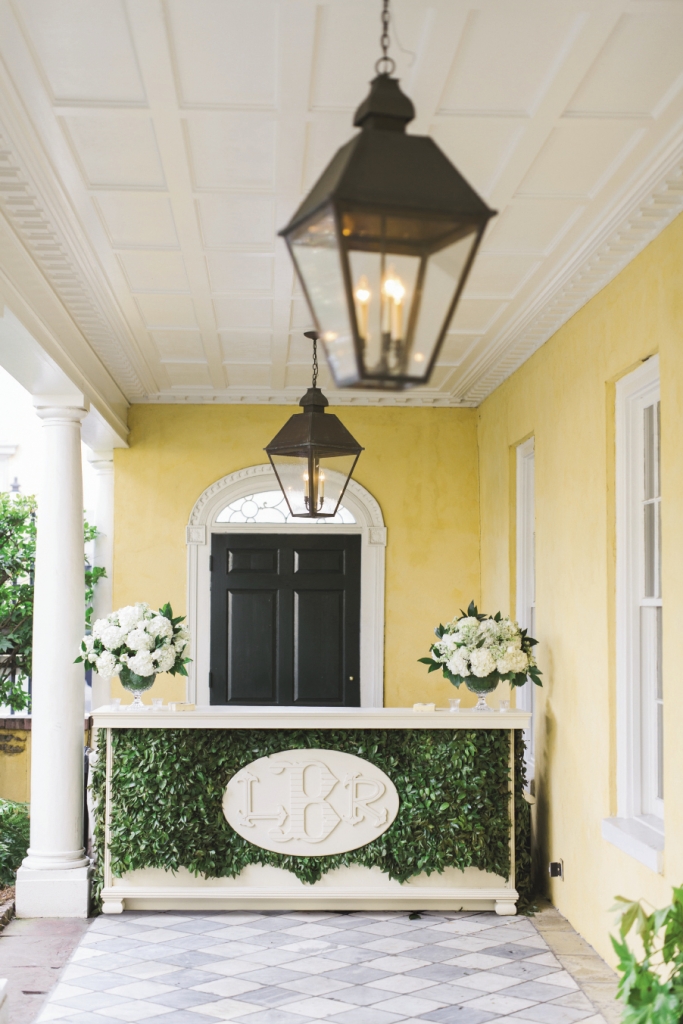 Laura fell head over heels for the monogram that decorated her printed goods, so planner  Kristin Newman worked with vendors to re-imagine  it several times over. Blossoms Events, for one,  embedded monogram plaques in lush greenery at all six bars. Wedding design by Kristin Newman Designs. Custom bar by Blossoms Events. Florals by Gathering Floral + Event Design. Image by Elisabeth Millay Photography at the William Aiken House.