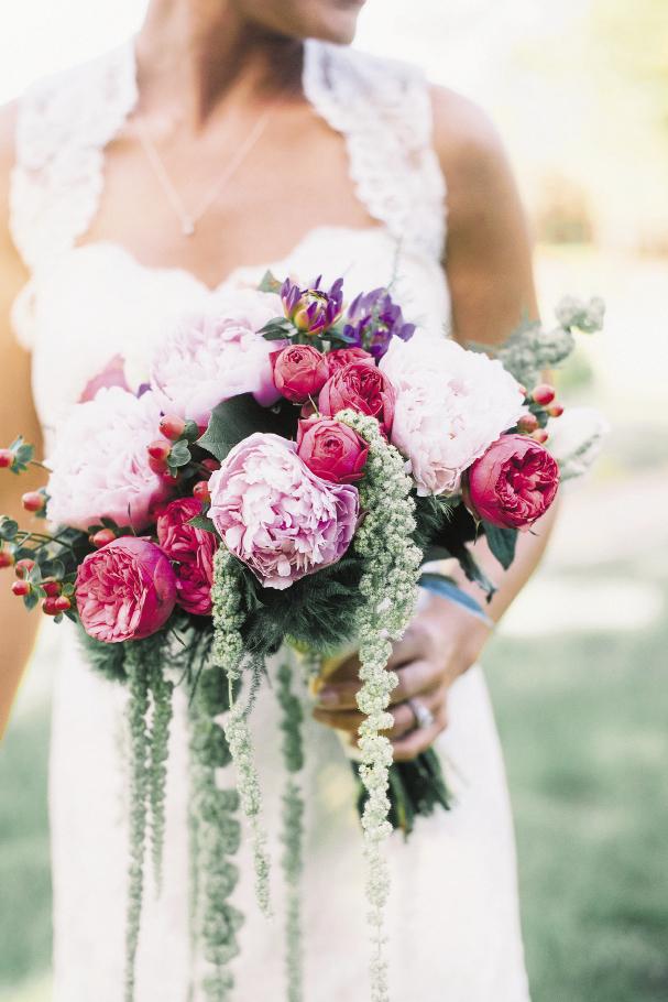 BLOOMING BEAUTY: A Charleston Bride’s Jonie LaRosee played with texture and color to create a bridal bouquet of peonies, hypericum berries, ranunculus, and hanging amaranthus.
