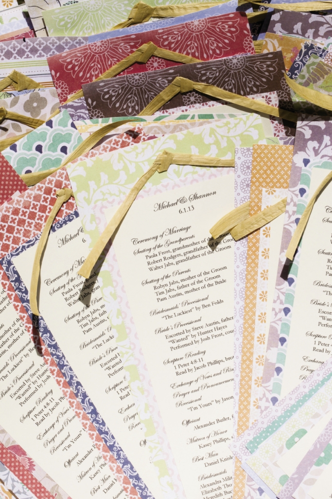 CRAFTY: Shannon, her mom, and sister adhered  ceremony programs to patterned card stock.