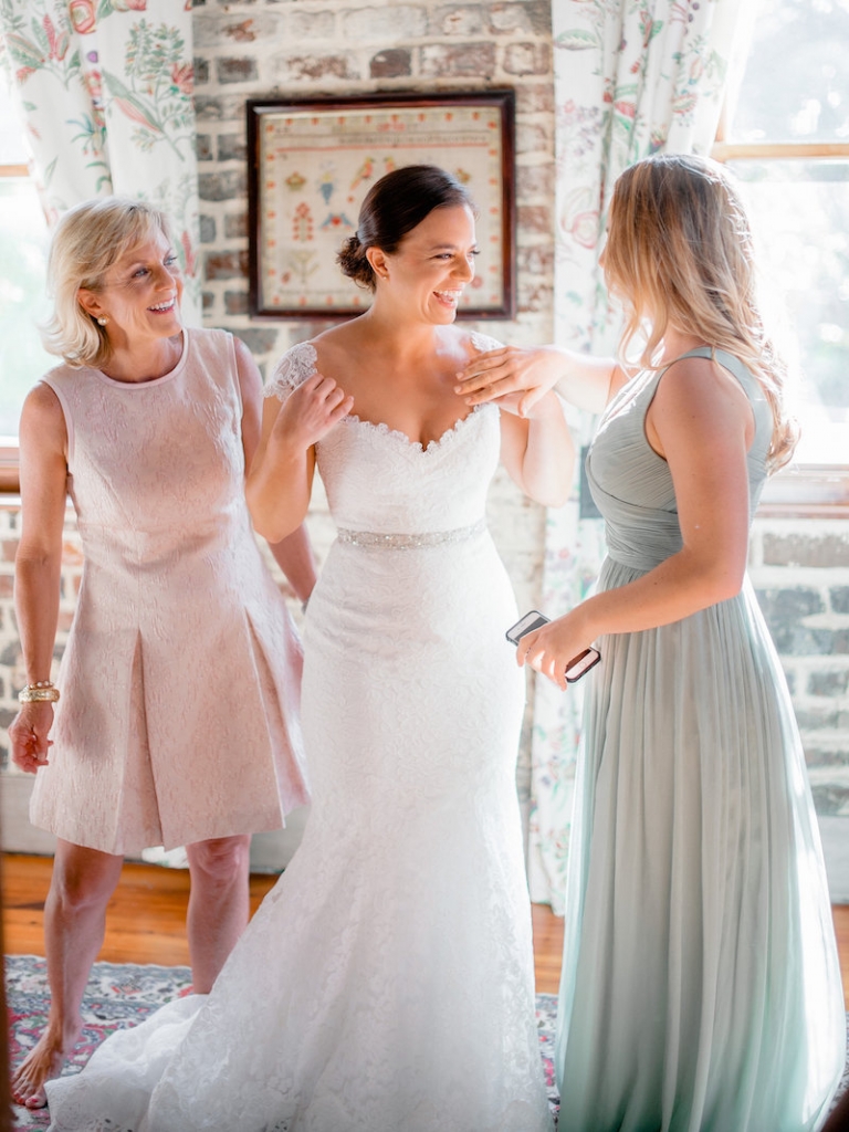 Bride&#039;s gown by Romona Keveza, available in Charleston through Maddison Row. Bridesmaid dress from J.Crew. Hair by SWISH. Makeup by Ooh! Beautiful. Photograph by Brandon Lata at the William Aiken House.