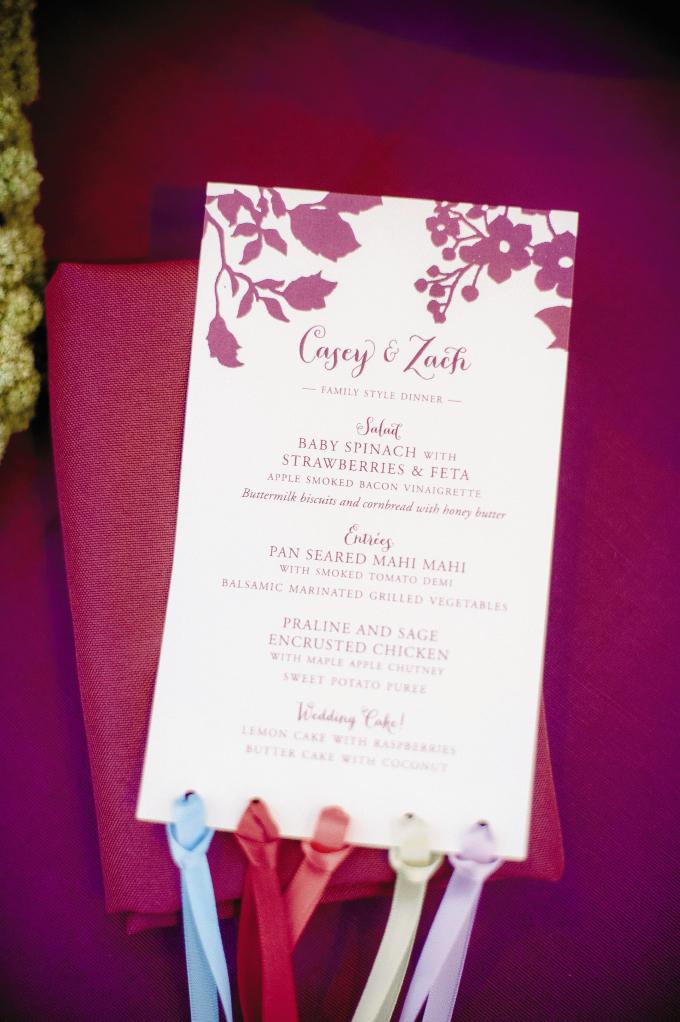 FRINGE BENEFITS: Programs by Studio R were looped with ribbons that repeated the colors of the ceremony site.