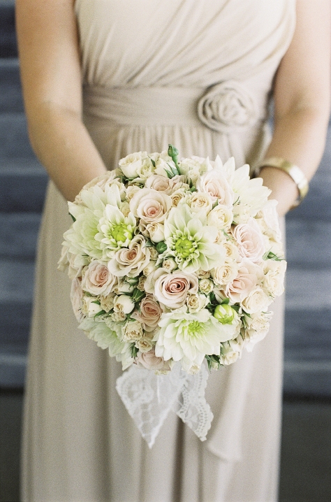 SWEET AND SIMPLE: Soirée&#039;s full-bodied bouquets blended ivory and soft pink dahlias, garden roses, and spray roses.