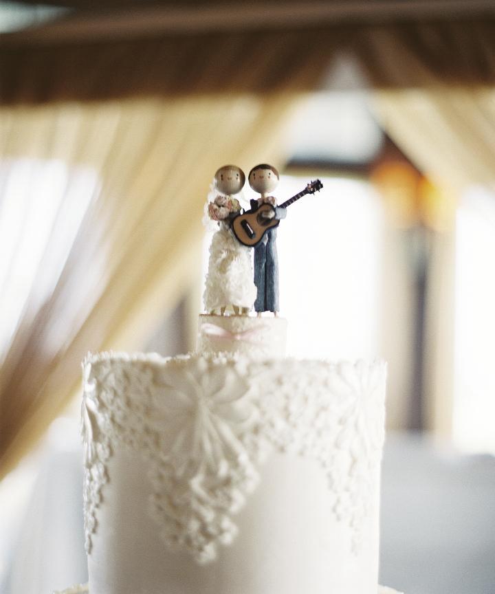 MUSIC MAN: Crystal&#039;s advice for brides-to-be? &quot;Add personal touches to make your wedding special and unique to you.&quot; For her part, Crystal commissioned this cake topper (the figurines were dressed like the bride and groom) from TheSmallObject.com. The guitar is an ode to the groom&#039;s love of music--Matt rocked Charleston for 10 years as the lead singer and guitarist of Milhouse.