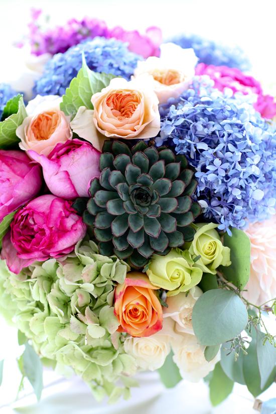 A BIT OF COLOR: Anne Bowen at stems arranged bouquets that popped against the cornflower blue bridesmaids dresses.