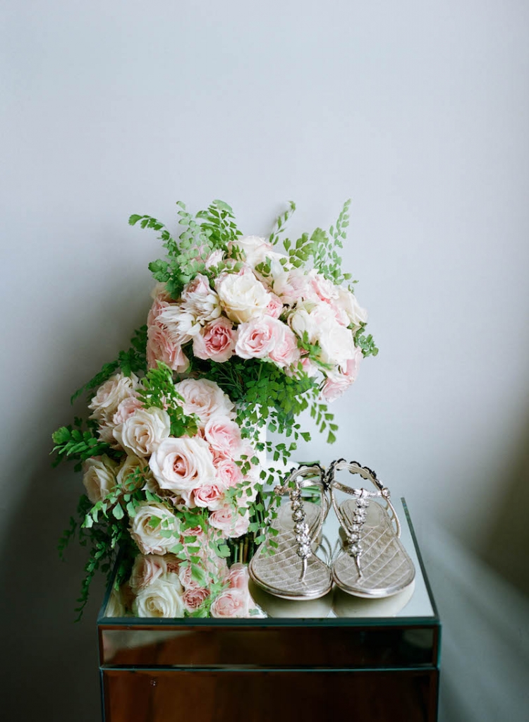 Florals by Tara Guérard Soirée. Bride&#039;s shoes by Chanel. Photograph by Elizabeth Messina.