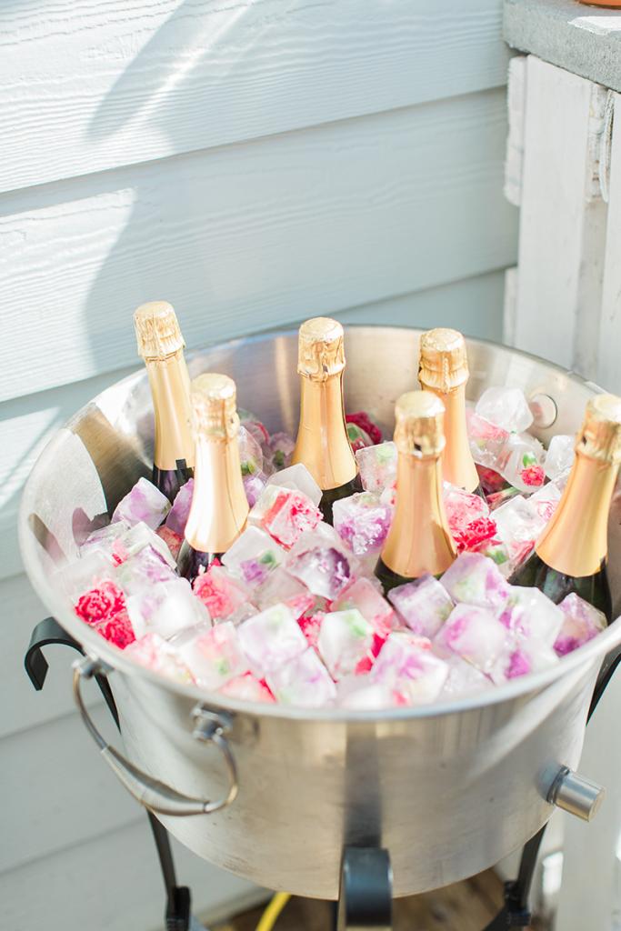 For bride Katie Berry’s flower-crown party, hostess Andrea Krause put the champs on ice with a little thematic flair. Freeze edible flowers in ice trays two days in advance and voilà! Your ice chest becomes a décor element.