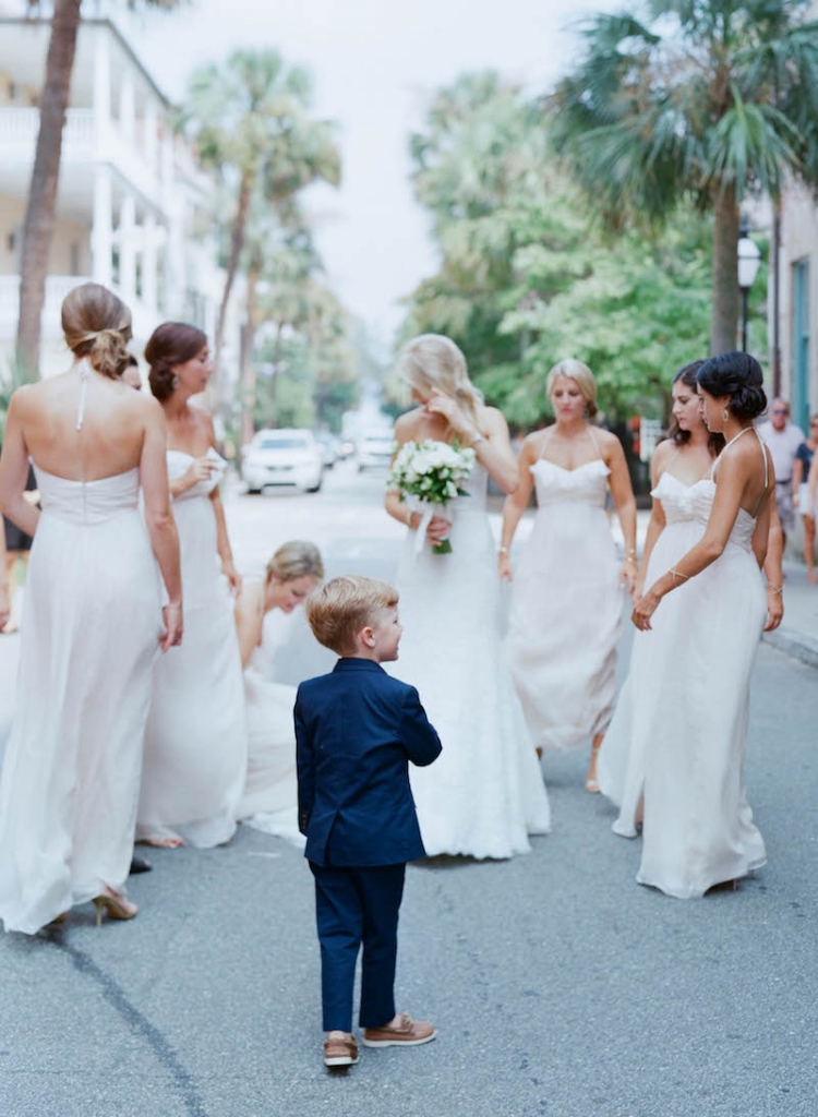 Bride&#039;s gown by Monique Lhuillier, available in Charleston through Maddison Row. Bridesmaid gowns by Amsale, available in Charleston through Bella Bridesmaids. Ring bearer attire from J.Crew. Photograph by Elizabeth Messina.