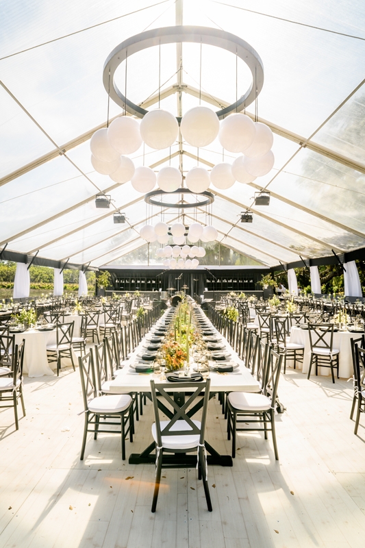 Kayle and Max said “I do” surrounded by the soft spartina grass and stately live oaks of Kiawah River. From the center of the chic dinner tent, a three-piece country band provided mealtime entertainment—and proved to be a highlight of the evening.