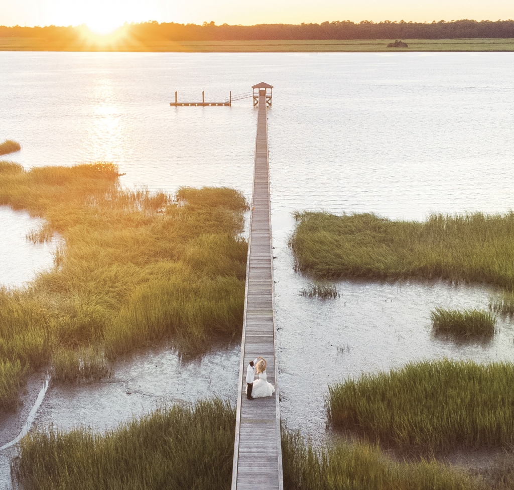 Floridians Morgan Dashiell and Tom Balestrieri wanted a destination wedding so they could spend more than one day with their guests. “It was important to find a place that would provide wonderful experiences, from food to drinks to scenery,” says Morgan. “We knew Charleston would absolutely live up to our expectations.” The couple wed at Lowndes Grove, where this drone shot was captured.