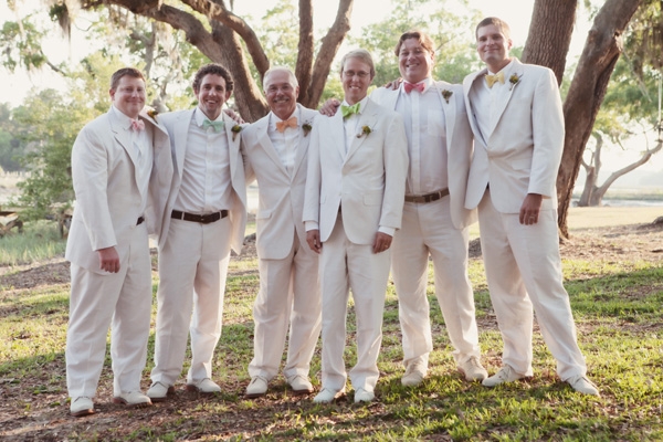 FASHIONABLE ENSEMBLE: For the occasion, Christopher and his groomsmen pulled off the quintessential Lowcountry get-up: light seersucker suits and brightly colored bow ties.