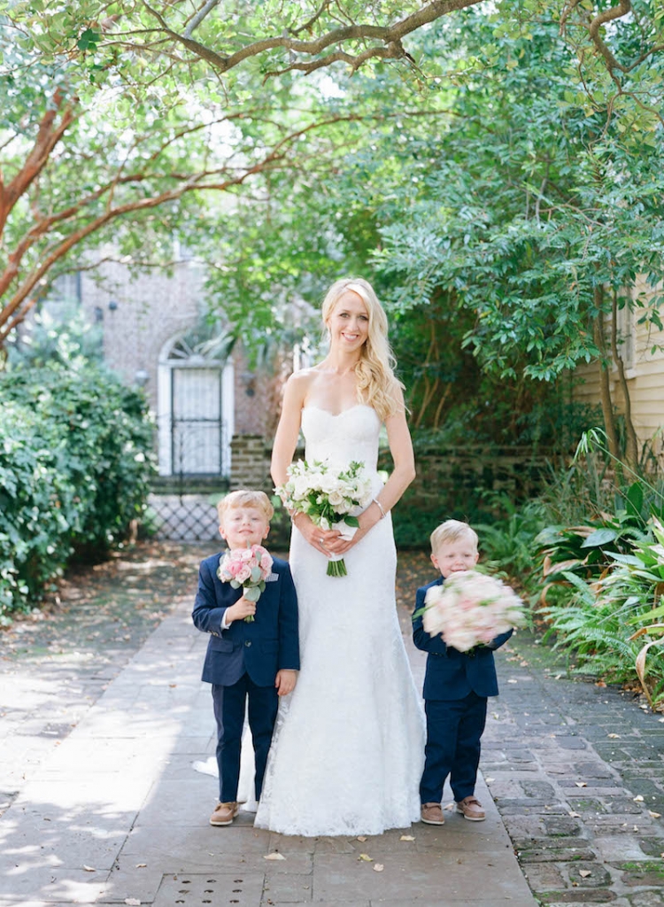 Bride&#039;s gown by Monique Lhuillier, available in Charleston through Maddison Row. Day-of gown preparation by Cacky&#039;s Bride + Aid. Ring bearers&#039; attire from J.Crew. Florals by Tara Guérard Soirée. Photograph by Elizabeth Messina.