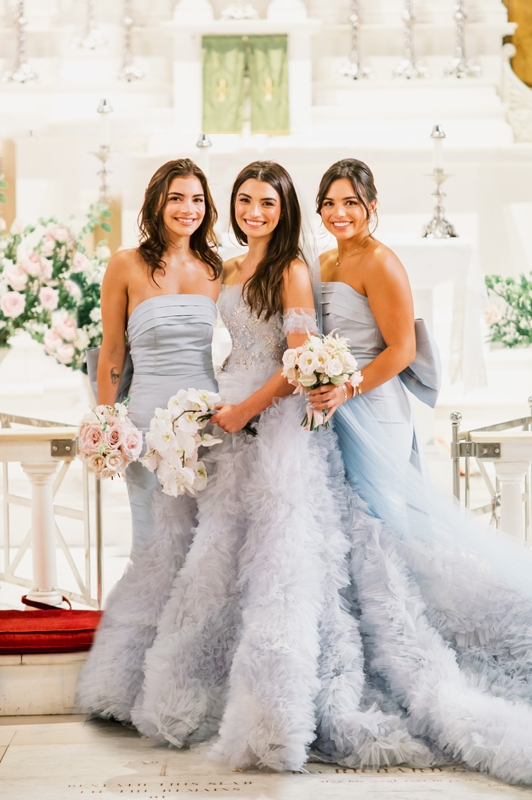 Bridesmaids also donned powder-blue dresses.