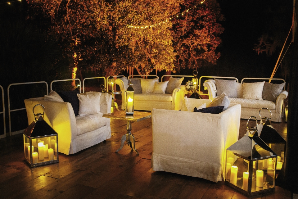 GLOW TIME: “We loved the patio under the trees with its beautiful white couches and strings of lights and lanterns,” Jessica says.