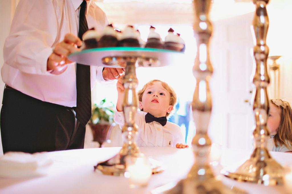 SNEAKY, SNEAKY: After serving as ring bearer, Henry Howard satisfied his sweet tooth with a mini chocolate cupcake.