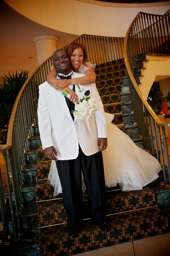 BIG DAY BLISS: “It was a great day that we’ll never forget,” says Richelle, posing with her husband on the grand staircase at the Charleston Place.