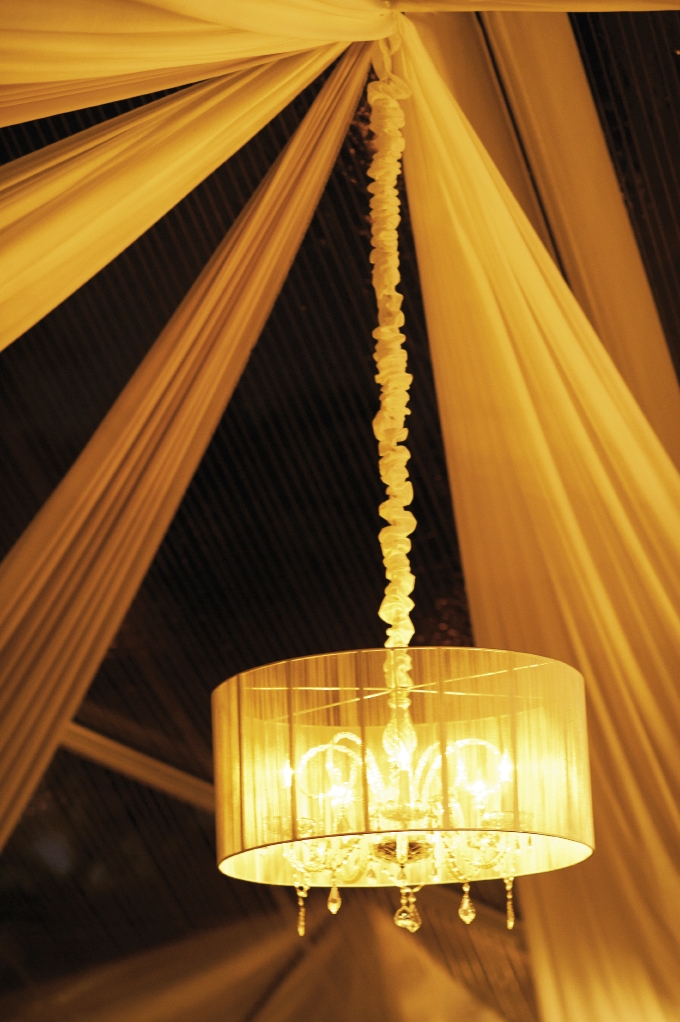 HEIGHT OF STYLE: Chandeliers with drum shades cast a soft glow over the evening and served as a subtle reminder of the grand dome chandeliers that were popular in the early 1900s.