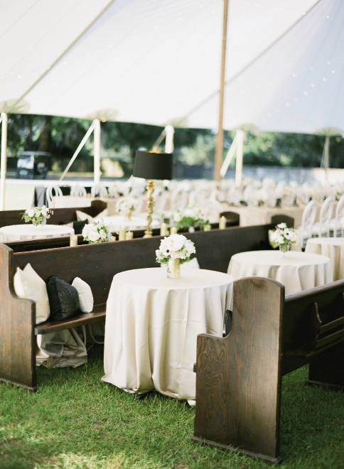 KICK BACK: Planners Amber and Emily paired extra pews with coffee tables for shaded lounge areas.