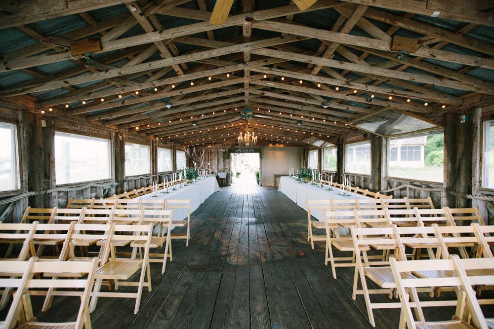 Wedding design by bride. Chairs from Snyder Events. Image by Susan Dean Photography at Bowens Island Restaurant.