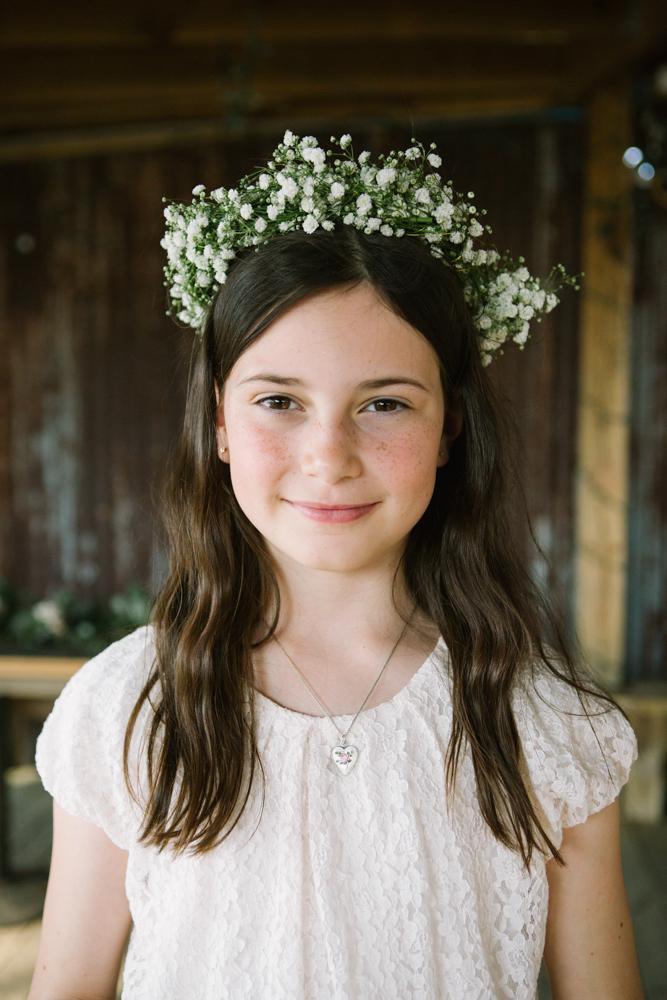 Flower girl’s dress from personal wardrobe. Florals by bride and friends. Image by Susan Dean Photography at Bowens Island Restaurant.