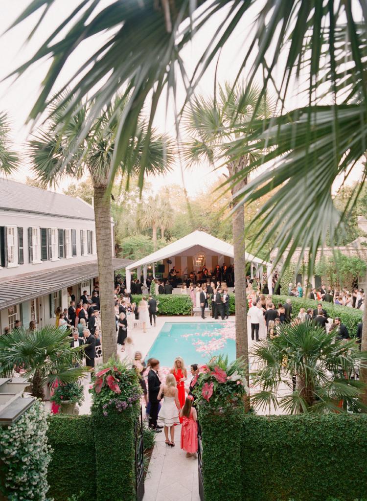 At first, the plan was to cap the pool with a dance floor. In the end, Gathering Events made the pool a focal point by filling it with blooms. “It was one of my favorite aspects of the wedding,” says Cate.