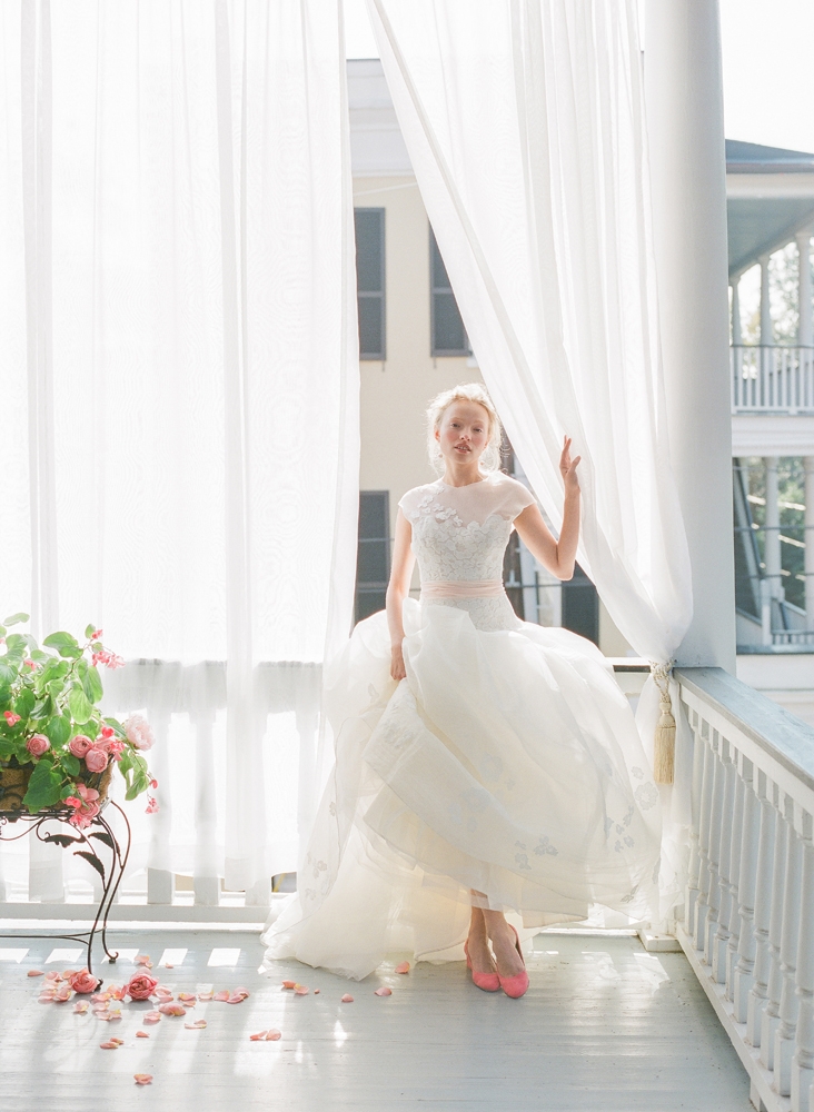 Peter Langner’s “Waking Up” silk organza and guipure lace ball gown from Betty Bridal Atelier. Mizuki’s pearl and gold earrings from Croghan’s Jewel Box. Jeffrey Campbell’s “Bitsie” suede pumps in dark coral from Shoes on King. &lt;i&gt;Photograph by Corbin Gurkin&lt;/i&gt;
