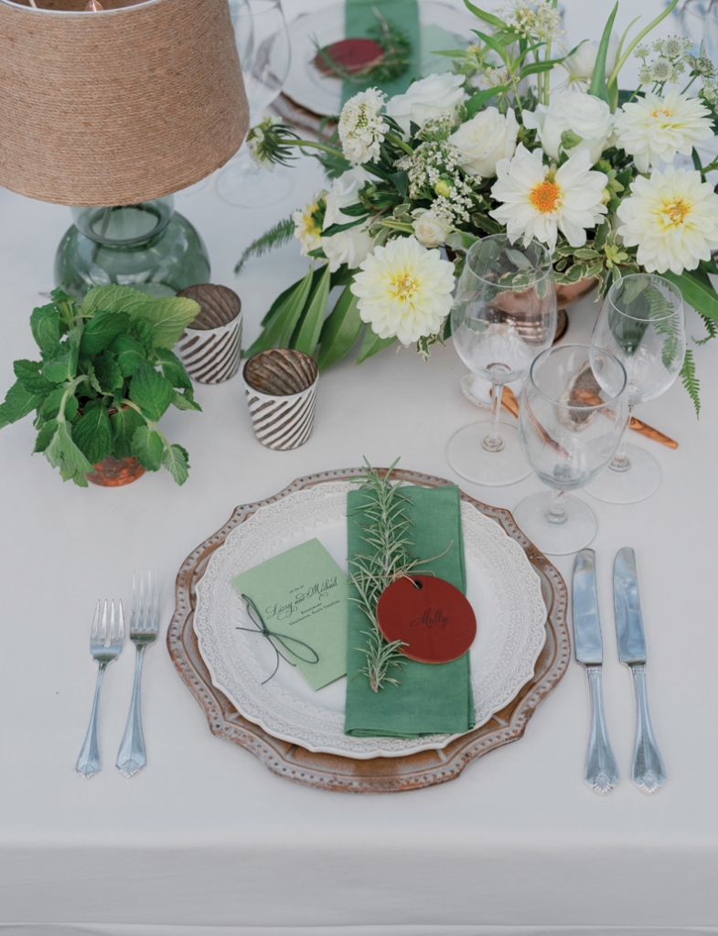 For dinner, the couple eschewed over-the-top floral displays in favor of an eclectic mix of pale blooms, carved votives, textured lampshades, and petite potted herbs that ran the lengths of their tables.