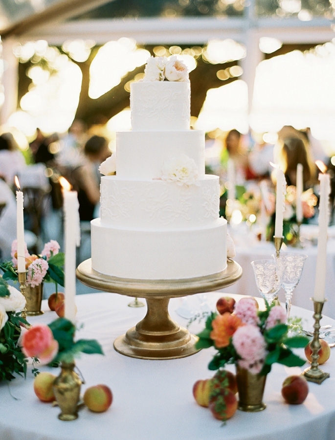 Give &amp; Take - Pale linens, icing, cake flowers, and tapers make colorful blooms (and fruit) stand out all  the more.