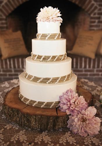 SIMPLE SWEETS: Lauren Mitterer of WildFlour Pastry baked a four-layer confection that she then ringed with wooden shoots banded together with pale pink ribbon.