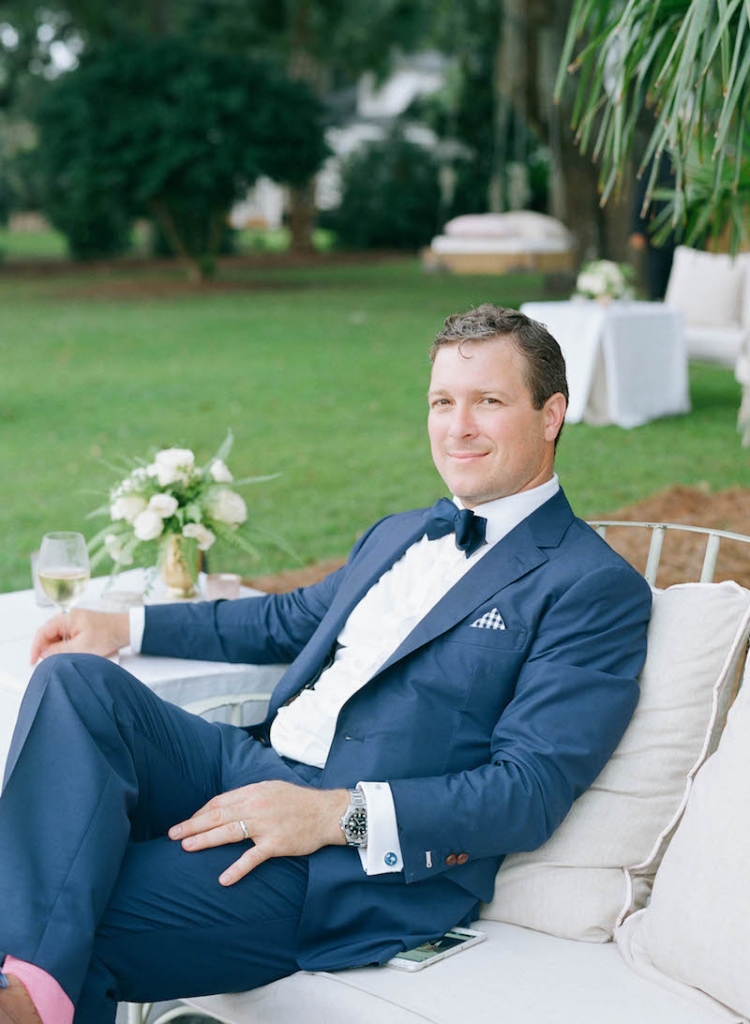 Groom&#039;s suit by Michael Andrews. Tie from The Tie Bar. Photograph by Elizabeth Messina at Lowndes Grove Plantation.
