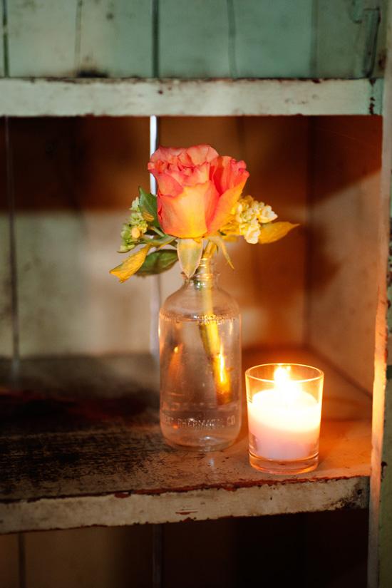 A LITTLE GOES A LONG WAY: A simple rose and solitary votive echoed Mary’s vision of a “vintage, organic, and laidback Lowcountry” affair.