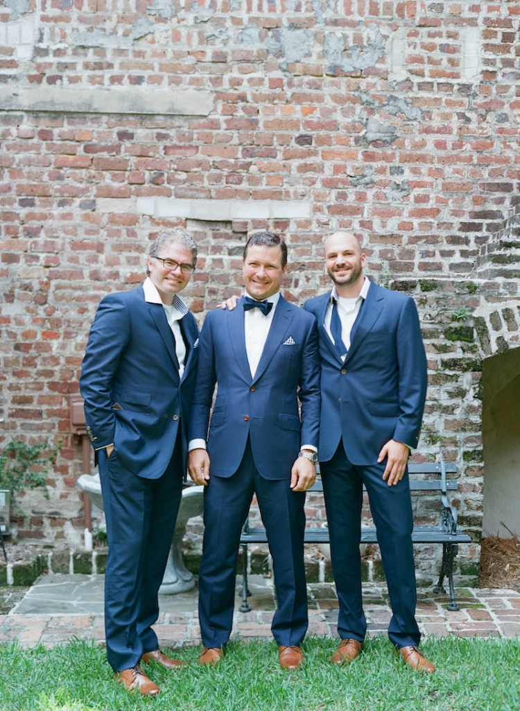 Groom&#039;s suit by Michael Andrews, tie from The Tie Bar, and shoes by Cole Haan. Groomsmen&#039;s suits from My.Suit, tie from The Tie Bar, and shoes by Cole Haan. Photograph by Elizabeth Messina at the French Huguenot Church of Charleston.