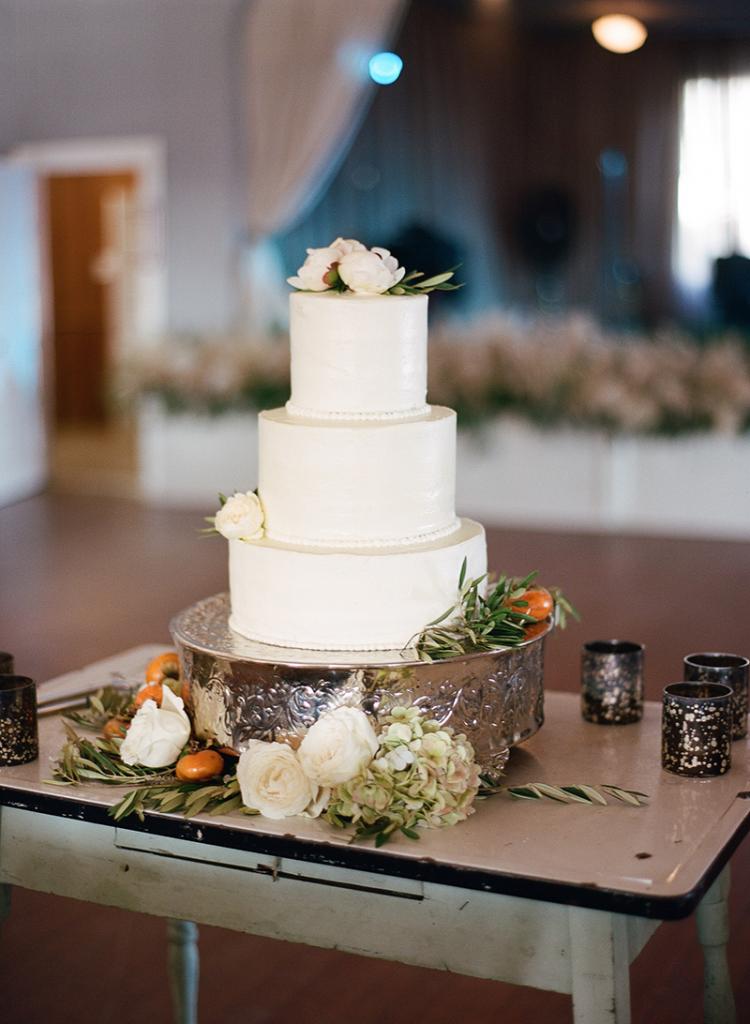 “Persimmons are a great autumn option that you can order on the branch,” says florist Anne Bowen of Charleston Stems. “The few surrounding the cake were the rebellious ones who preferred to participate in the wedding off the branch.” Christen Reese of Chocolate Cake—a go-to for townies looking for special occasion treats that are utterly, divinely homemade—stepped out of the cocoa realm for this three-tiered confection.