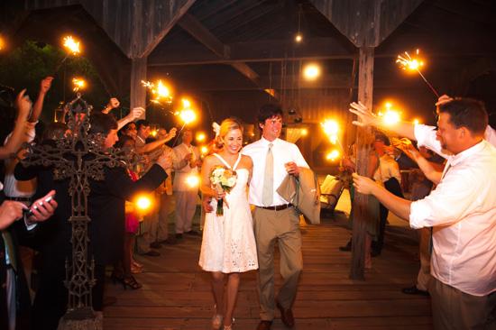 PRETTY PYROTECHNIQUES: Mary and Moyer were all smiles as they exited The Cotton Dock amidst a sea of long-stemmed sparklers.