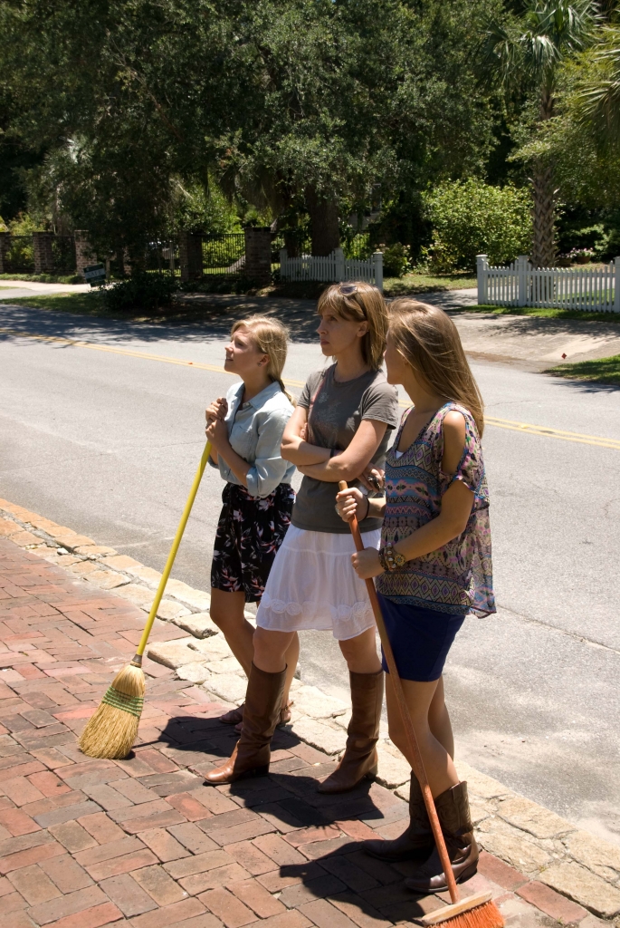 Molly Hutter (Charleston Weddings’ editorial assistant), Melissa Bigner (editor), and Lizzie Gheorghita (intern) survey the church front to make sure it’s ready for the shoot. We really should have staff brooms at this point for how often we’re sweeping up sets…