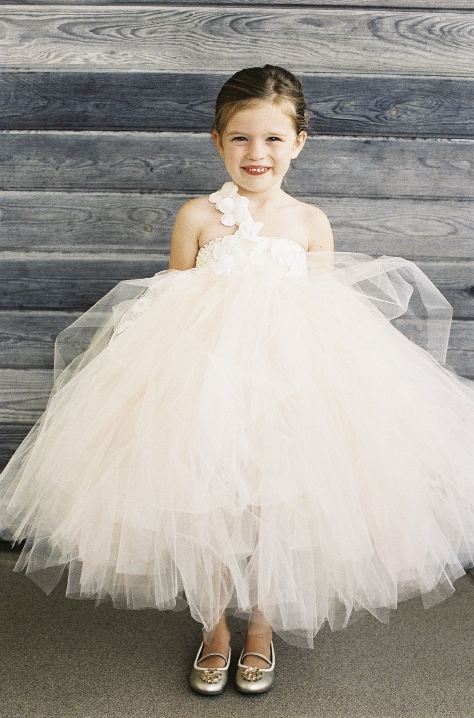 PRETTY AS A PRINCESS: Matt&#039;s niece, Avery Cate (here in a tulle frock from Laurie&#039;s Tutu Boutique), scattered petals across the aisle before the ceremony.