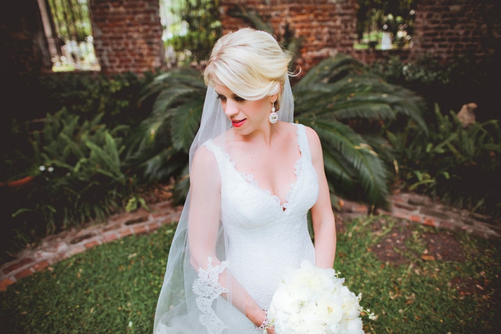 BRIDAL PORTRAIT: Loluma arranged an all-white bouquet to complement Allison’s Romona Keveza gown.