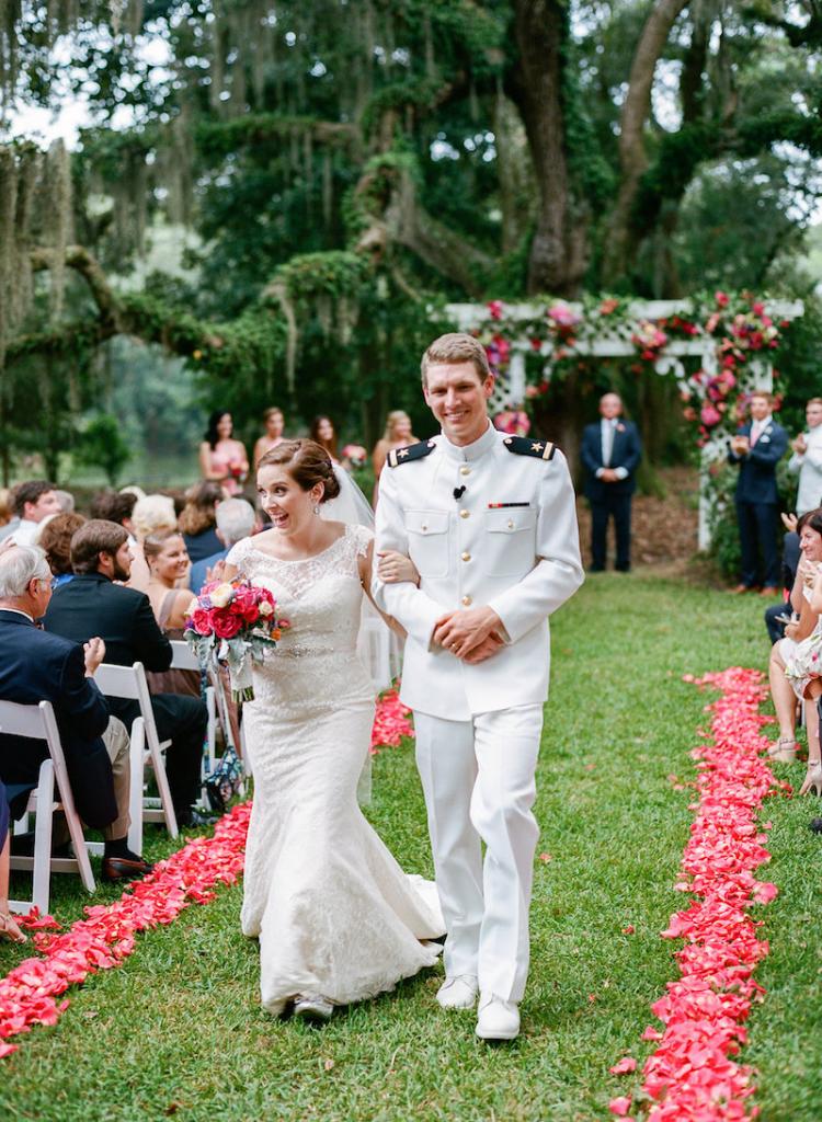 Bride&#039;s gown by Augusta Jones from Gown Boutique of Charleston. Florals by Engaging Events. Photograph by Marni Rothschild Pictures at the Legare Waring House.