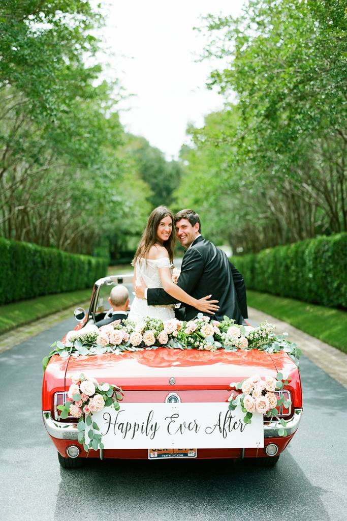 The couple left the reception in the father of the bride’s 1965 Ford Mustang convertible. Brooke’s mother penned the “Happily Ever After” sign, which now hangs in the newlywed’s bedroom.